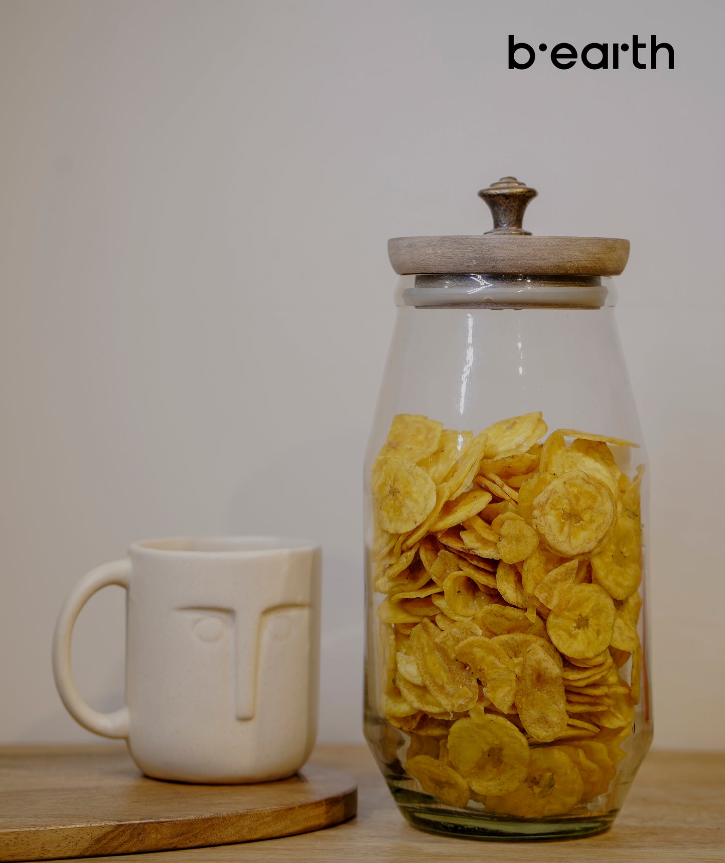 Clear glass jar with wooden lid.